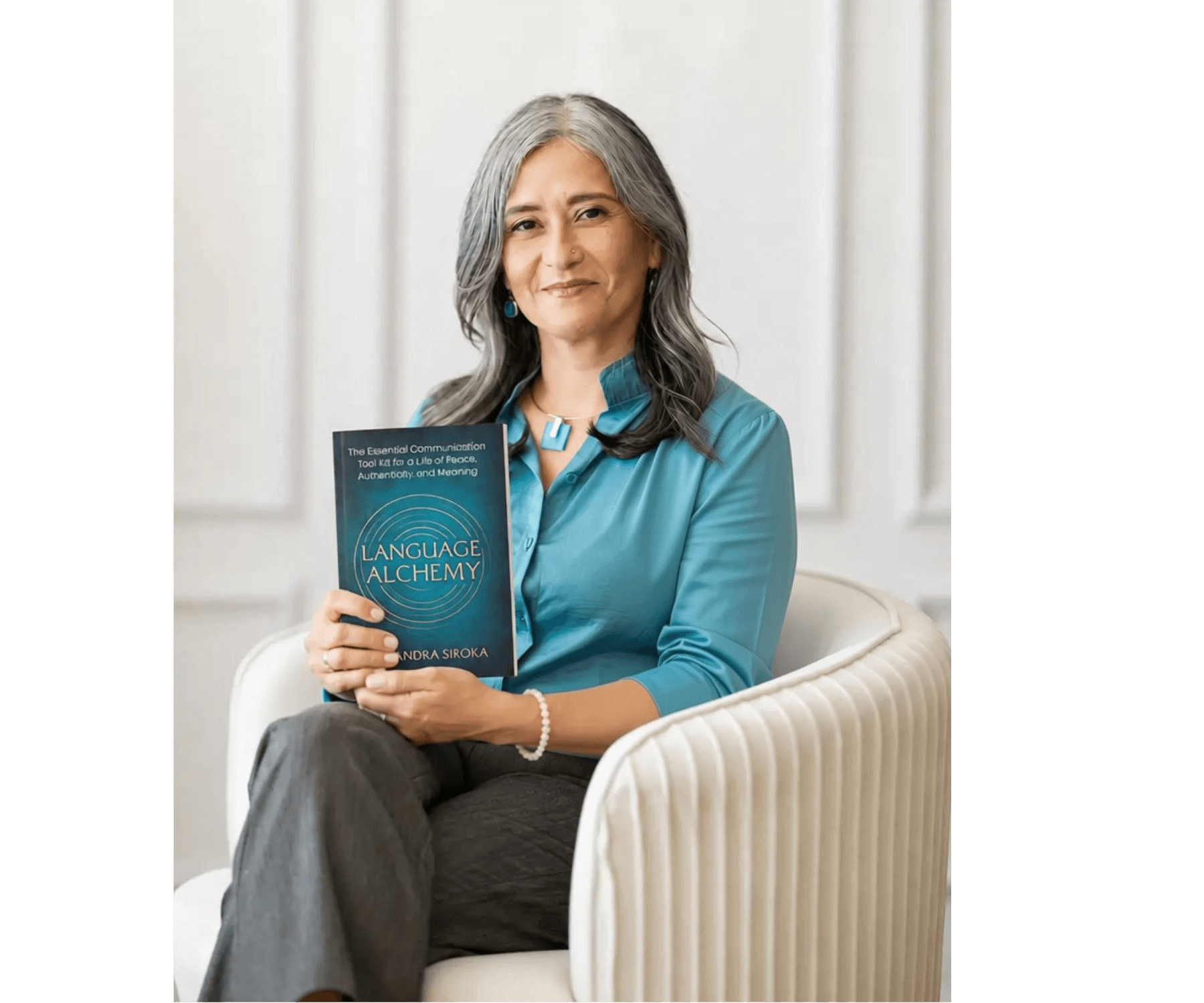 Alejandra Siroka holding a copy of Language Alchemy